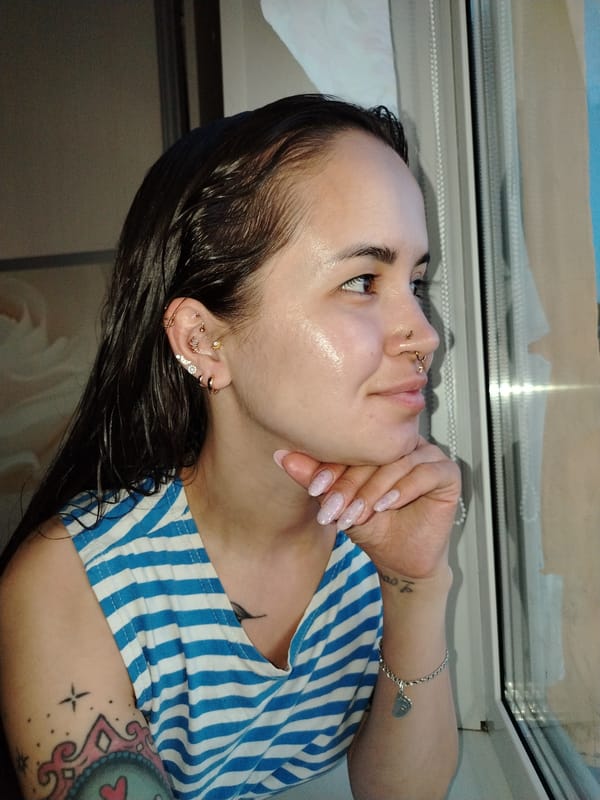 Tattooed woman's quiet afternoon documented in Noviy, Russia