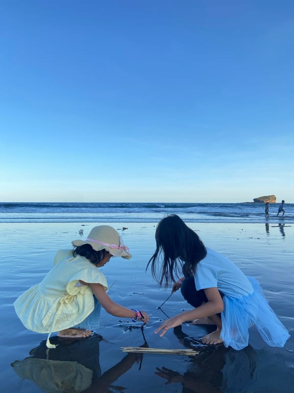 Families enjoy morning beach outing at Indonesian coastal location