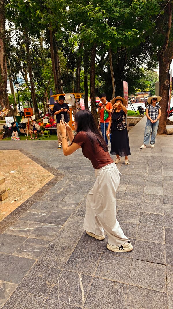 Early morning tourists photograph landmarks in Hà Giang Ward
