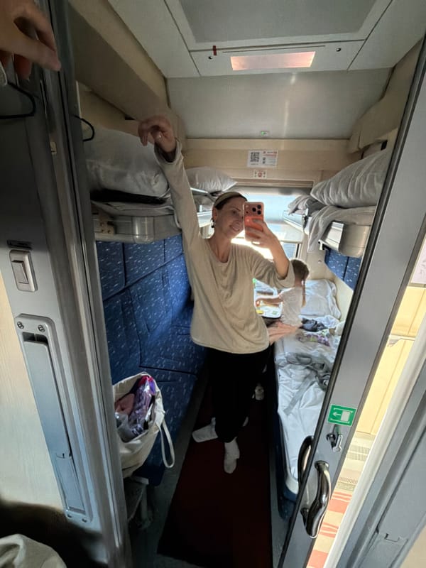 Woman takes selfie in train compartment near Saratov Station