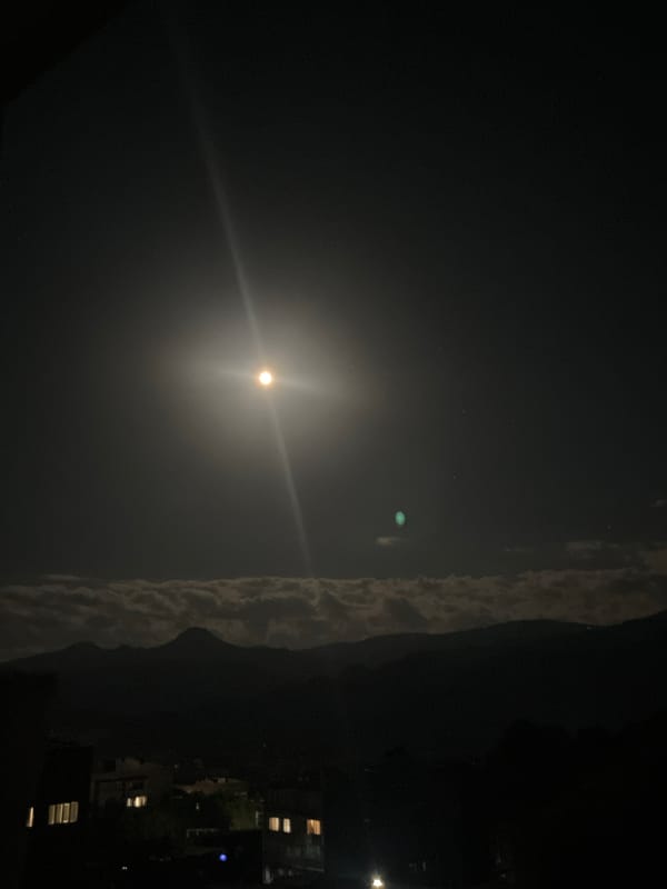 Full moon rises over a residential neighborhood in Gladzor, Armenia