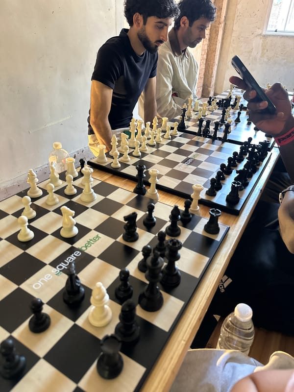Two men play chess on large board in London