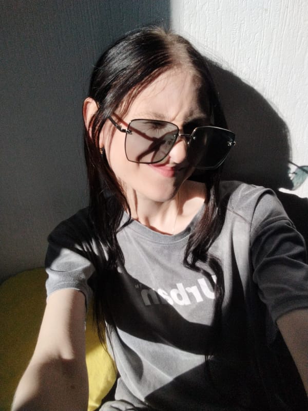 Indoor selfie session, grey tee and sunglasses, midday light