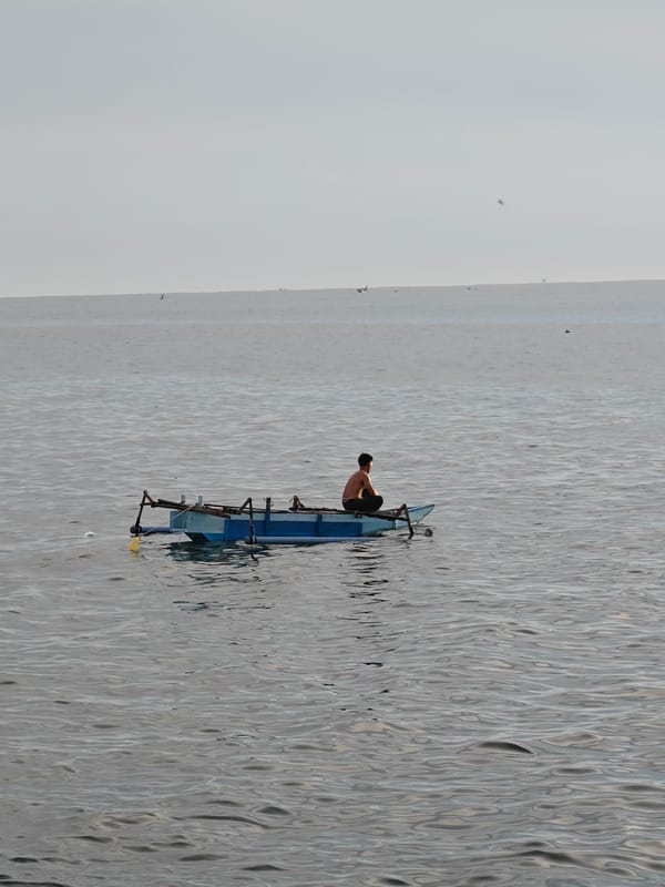 Lhokseumawe fishing harbor on a calm overcast morning