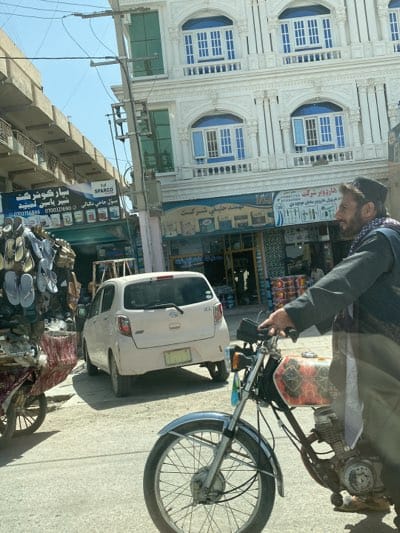 Morning sandal vendors draw customers on Kandahar street