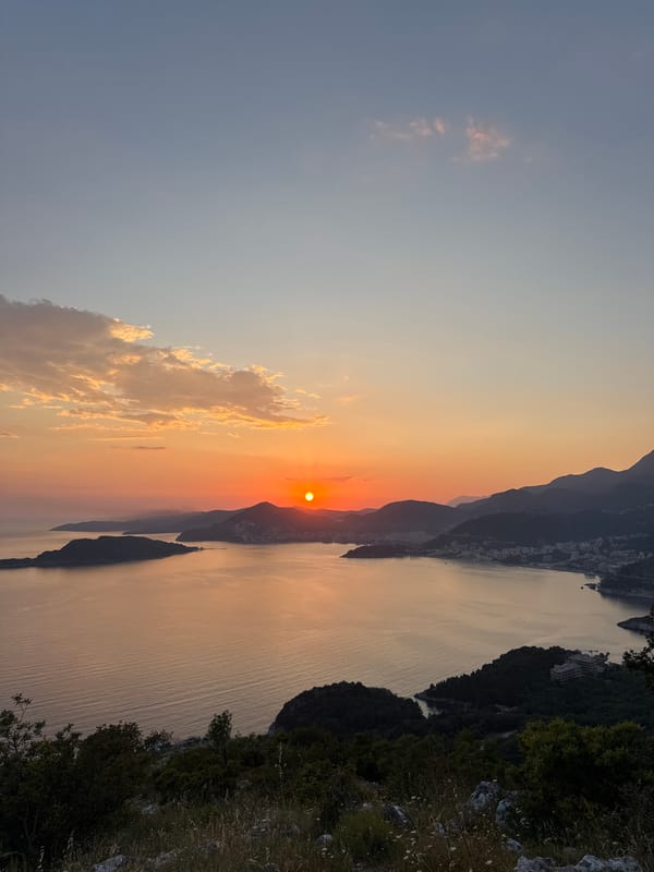 Sunset framed by hand gesture captured in Montenegro