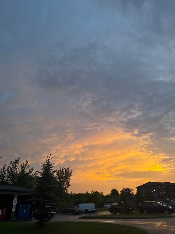 Striking summer sunset over a Gatineau parking lot