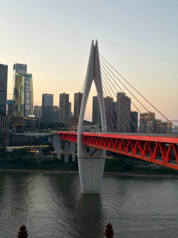 Dusk at Hongyadong: lit-up waterfront, crowds, and traditional dress
