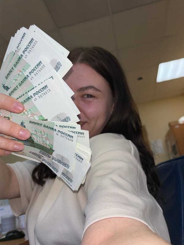 Woman handles Russian rubles in Perm office setting