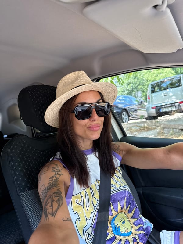 Reclining in a car, straw hat and sun-moon shirt in Pleven