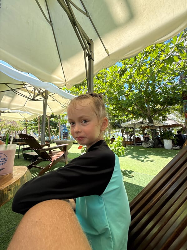 Cafe stop in Nha Trang with drinks, snacks, and a dog