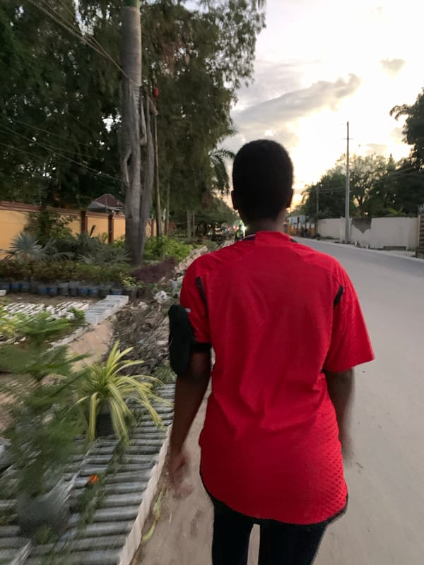 Afternoon to dusk in Dar es Salaam — streets, soccer, and city lights