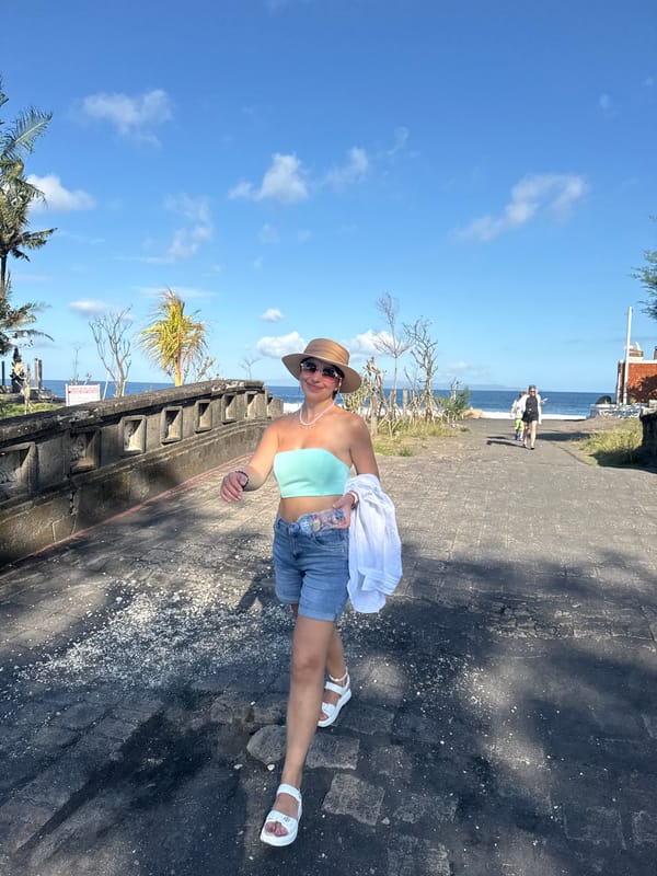 Morning beach activity captured at Blahbatuh's black sand shores