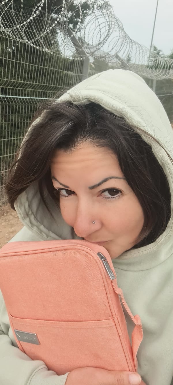 Woman with bag observed near security fence in Lachish