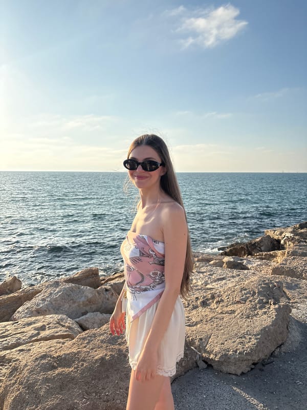Friends pose for photos along Tel Aviv Mediterranean coastline