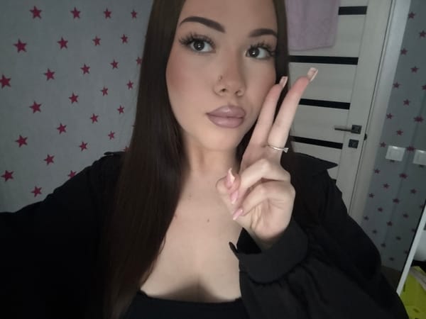 Young woman takes multiple selfies in Russian bedroom