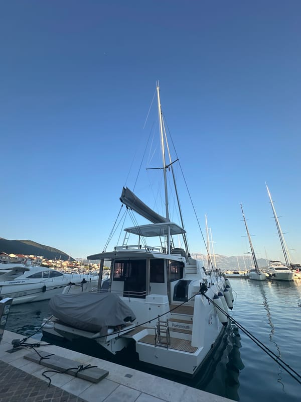 Ponant cruise ship anchored off Herceg Novi's busy marina