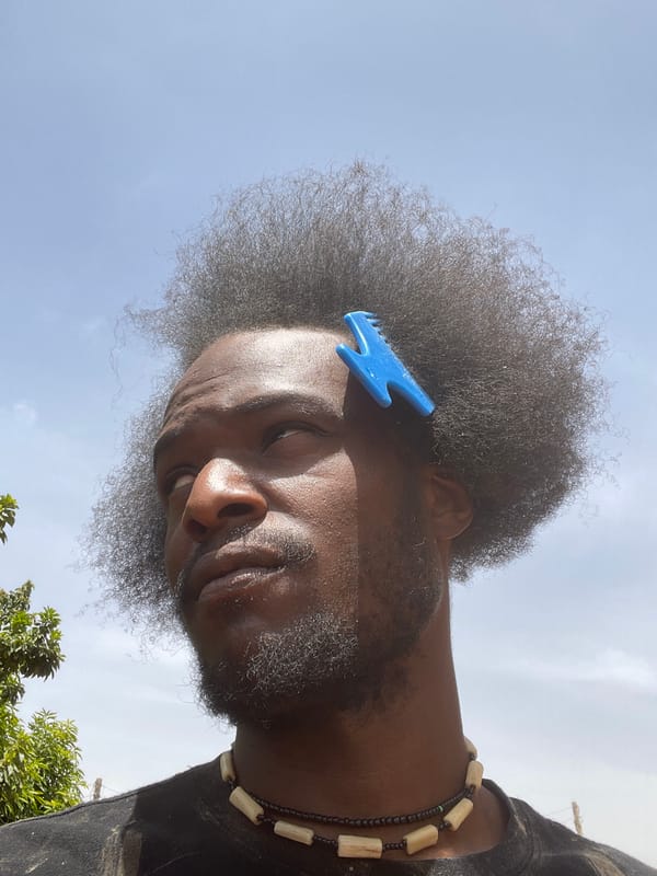 Man with blue comb photographed in Jos, Nigeria