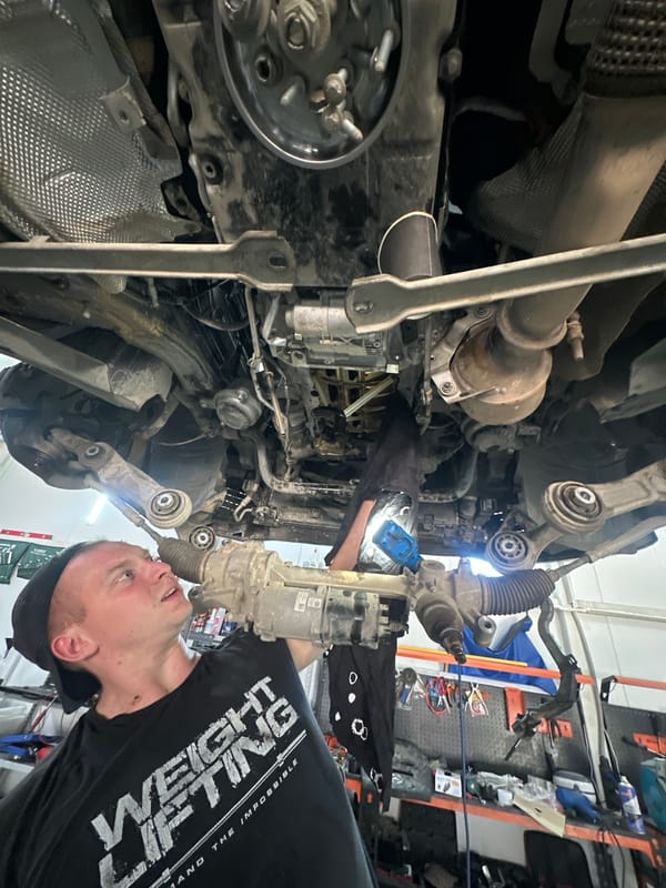 Mechanic services Mercedes while grilling lunch in Blagoveshchensk garage