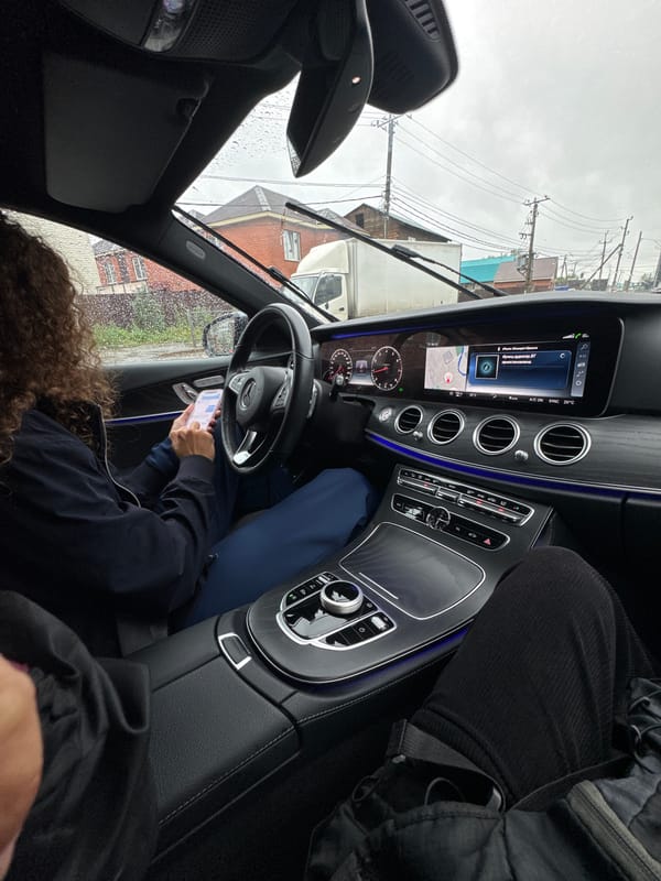 Checking navigation on a rainy drive through Irkutsk
