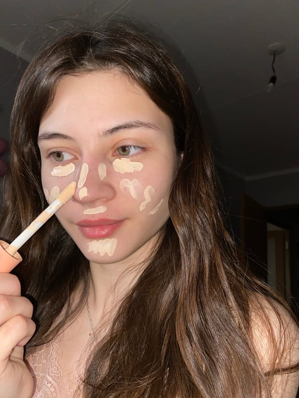 Woman applies makeup early morning in Votkinsk, Russia