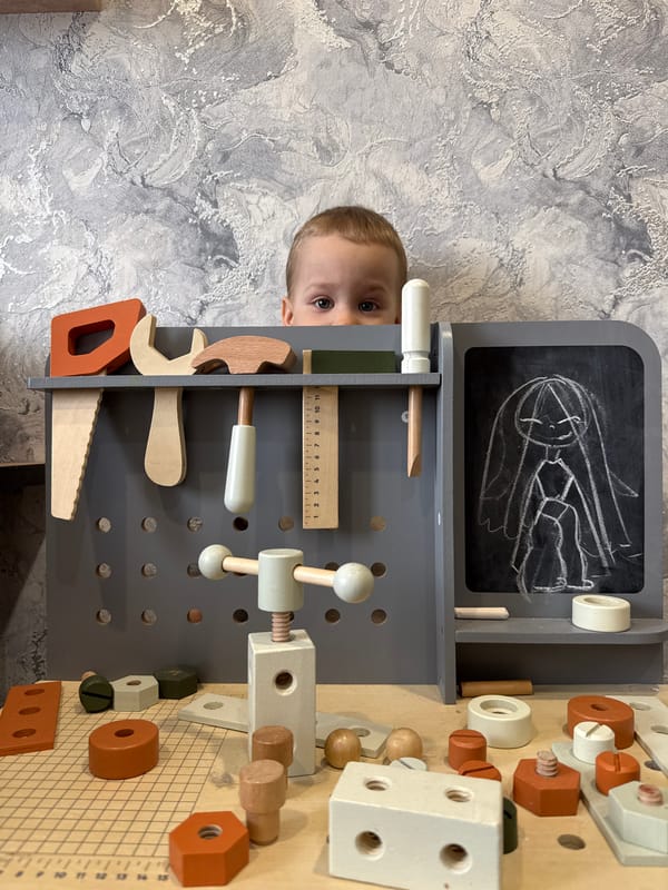 Child plays with bubbles and toys in Rusanovo home