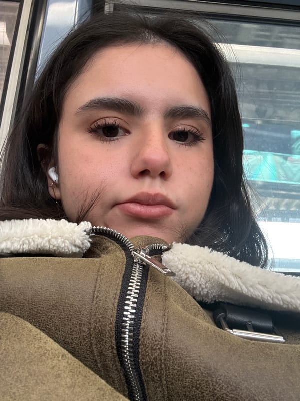 Portrait of person in brown jacket on Chicago transit