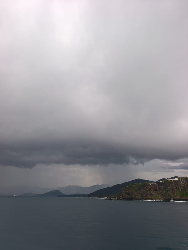 Storm clouds gather over Karangasem coastline in Indonesia
