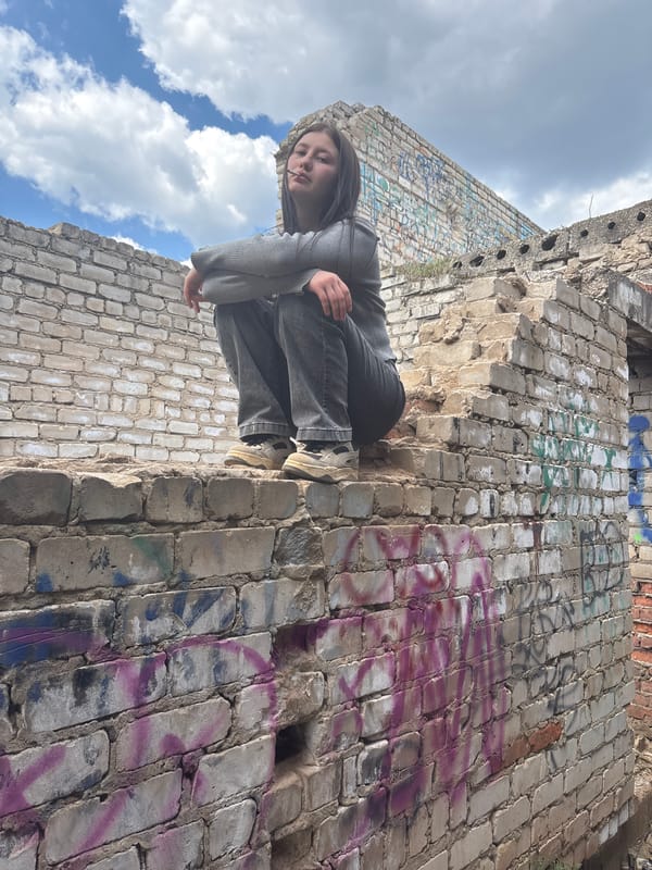 Woman spotted on graffitied ruins in Фоки, Russia
