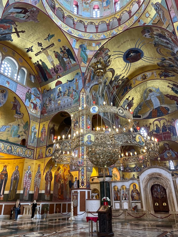 Church interior with golden religious artwork documented in Podgorica
