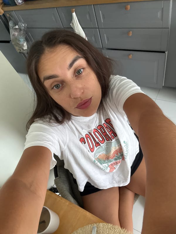 Woman takes selfie while YouTube plays on TV in Thailand