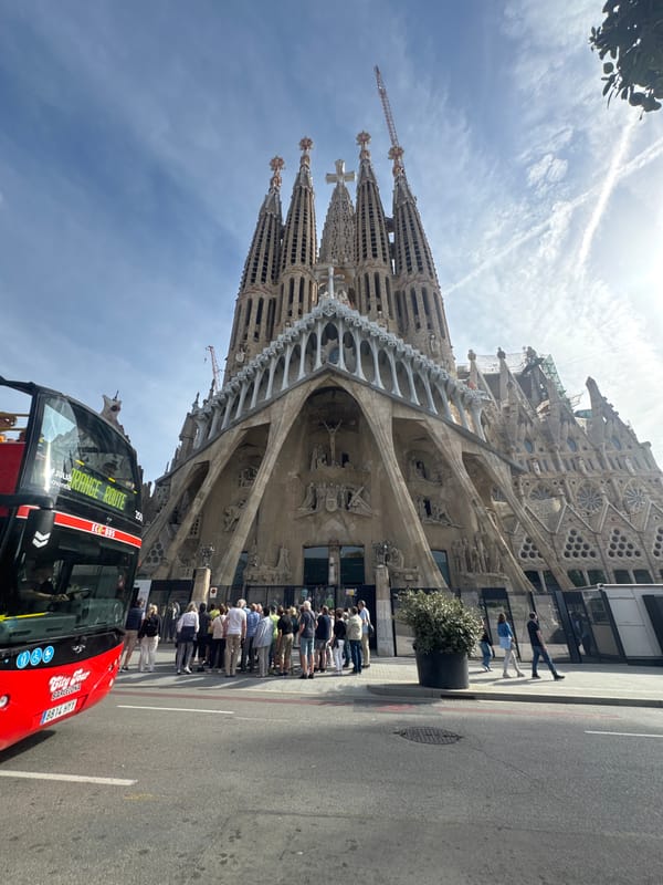 Tourist with walking stick visits Sagrada Familia in Barcelona