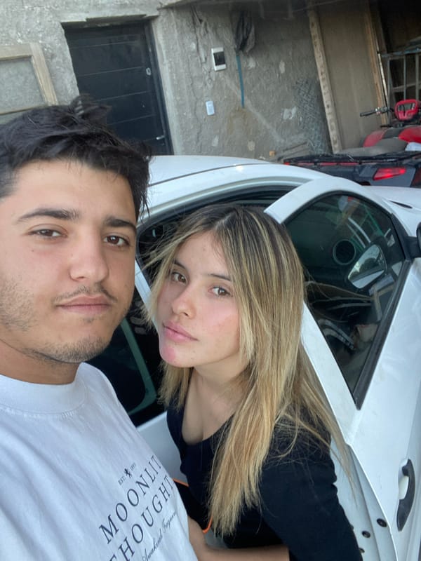 Couple takes evening selfies with dog in Sumalao, Argentina