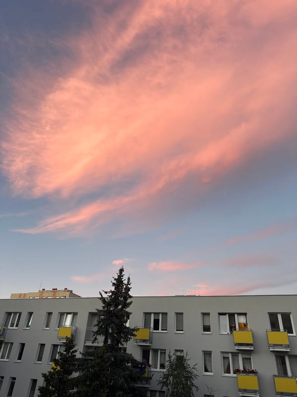 Warsaw balcony at golden hour, plants and pastel skies