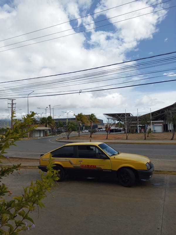 Taxi and storefronts photographed in Juan Griego, Venezuela