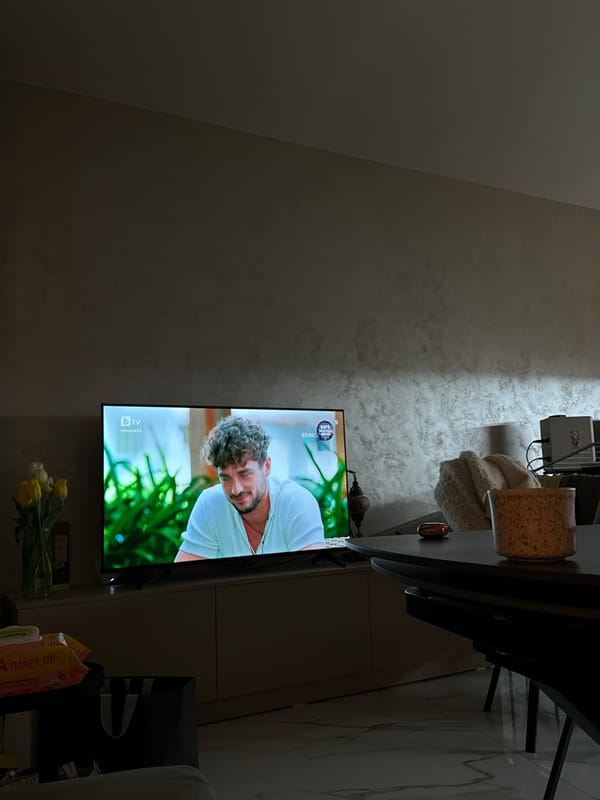 Person relaxes at home with smartphone in Sofia