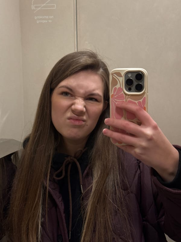 Woman takes selfie at Belgrade cafe during coffee break