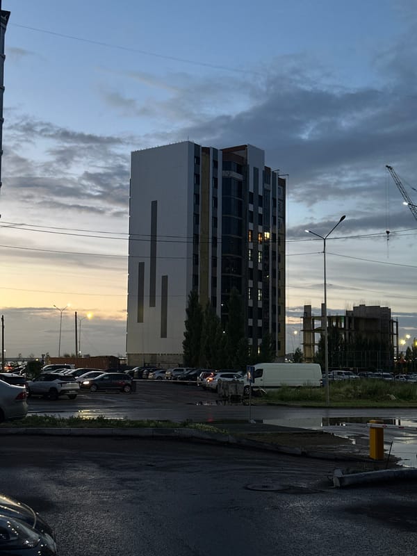 Dusk settles over a Kokshetau residential complex