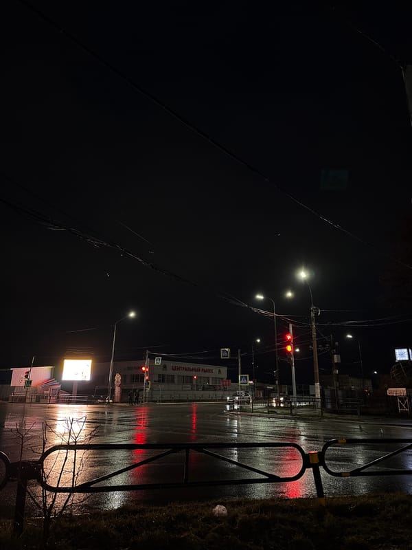 Wet streets reflect light after rain in Chaikovsky, Russia
