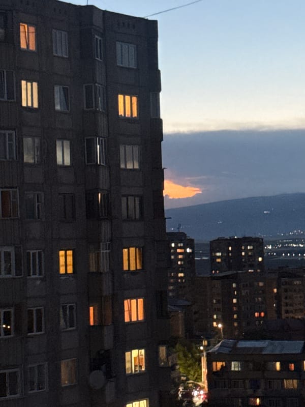 Twilight falls over Abovyan's apartment blocks and mountain backdrop