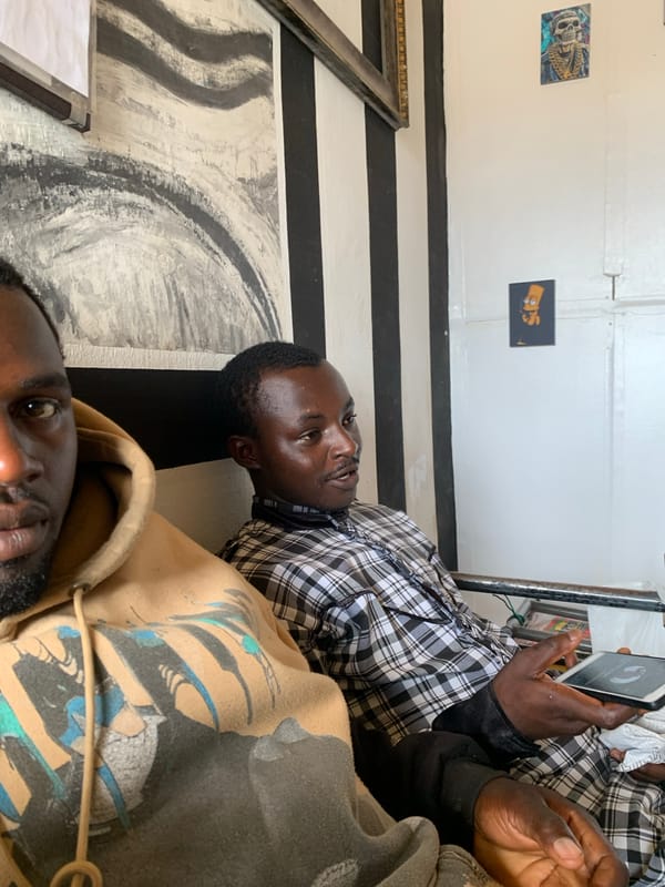 Two men observed indoors in Jos, Nigeria