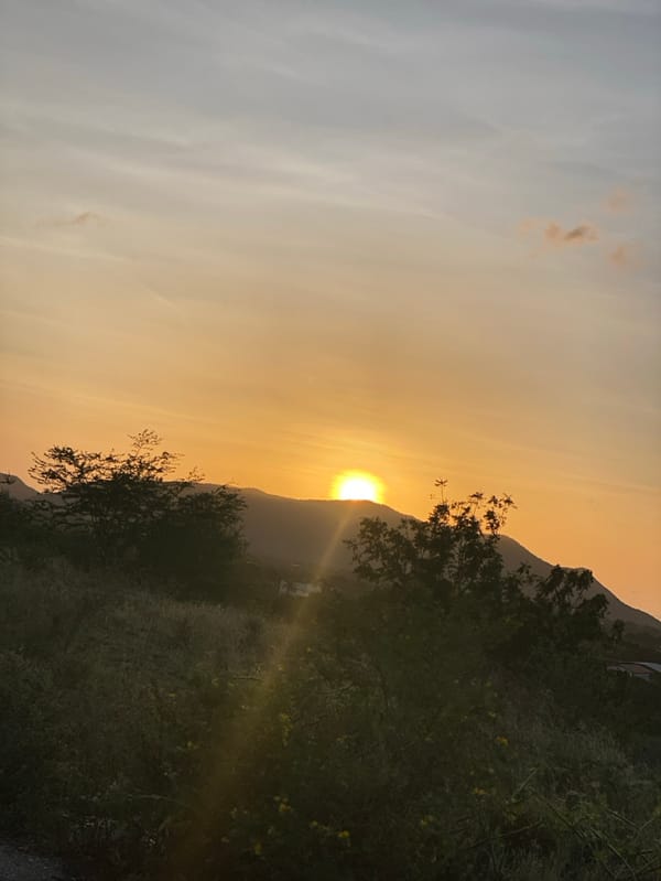 Couple documents sunset visit to Venezuelan hillside overlook