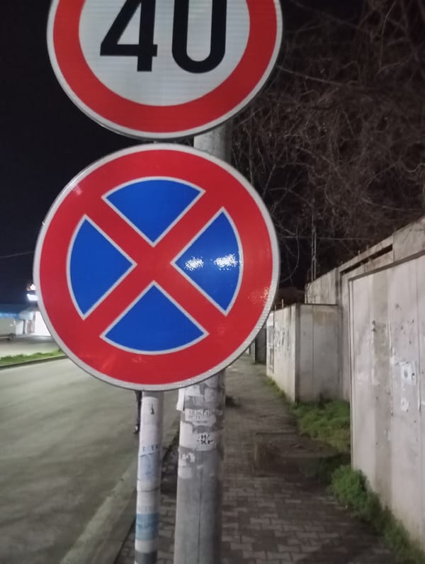Traffic signs document speed limit and parking restrictions in Sevlievo