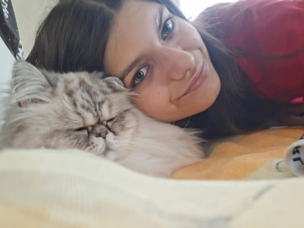Woman takes selfies with cat in Panagyurishte bedroom