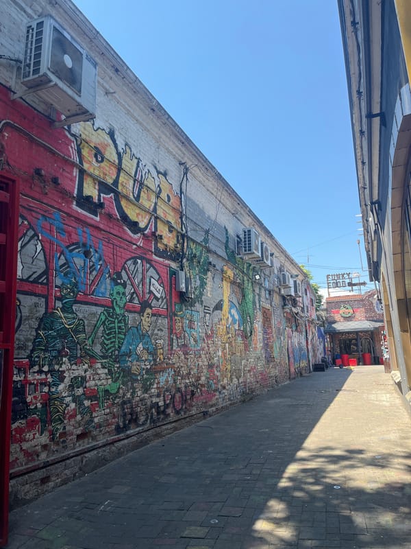 Street-level morning in central Krasnodar, shops, landmarks, and local life