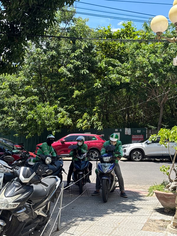 Motorcycle riders and street style on a Nha Trang sidewalk