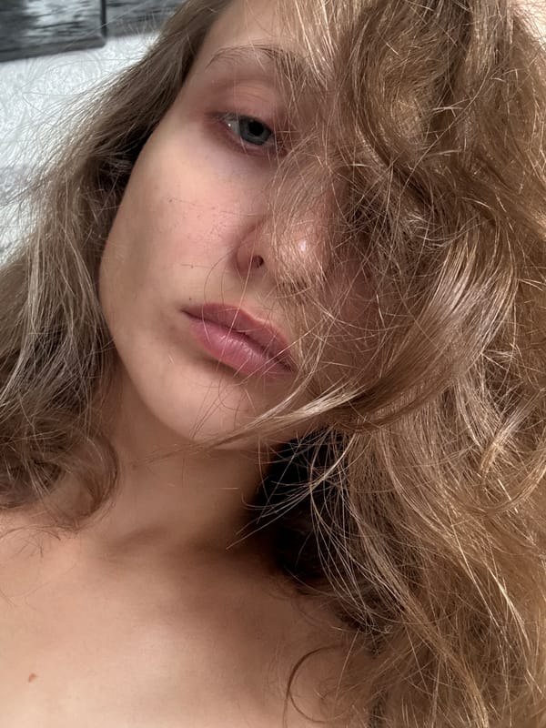 Indoor selfie session in a Kuyeda apartment, July 2026