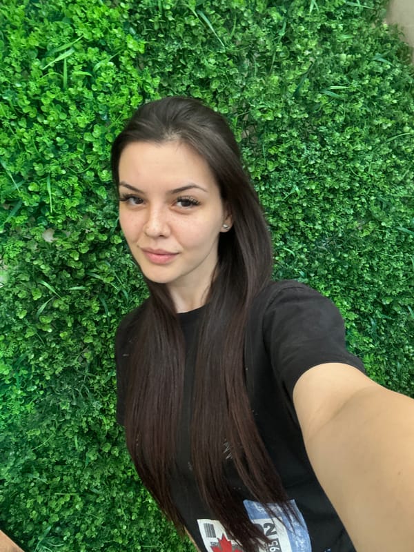 Quick selfie session against a green hedge wall in Sliven