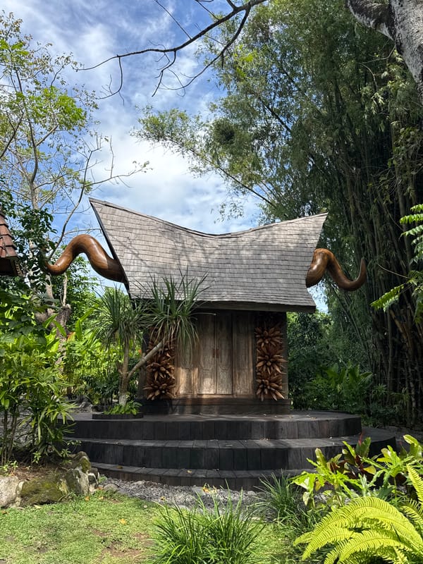 Traditional Balinese sculptures documented in Kediri garden setting