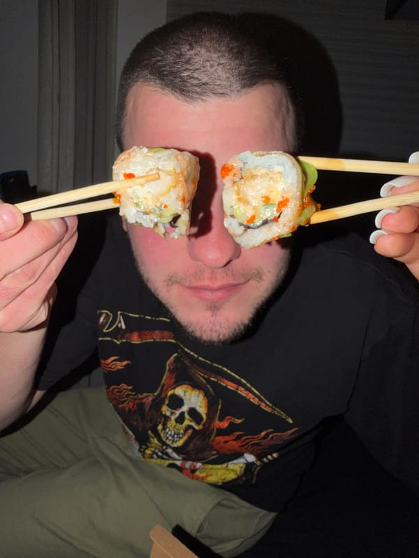 Man playfully eats takeout sushi in Varna, Bulgaria